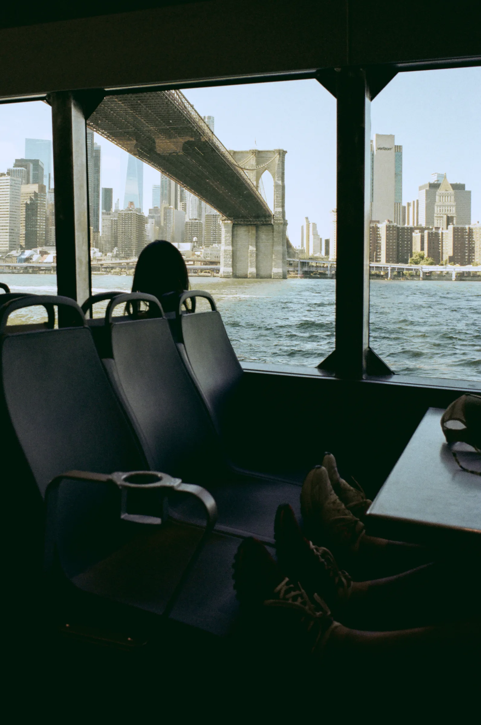 The Brooklyn Bridge and Manhattan skyline through a ferry window, with a LiDAR distance reticle placed on the scene